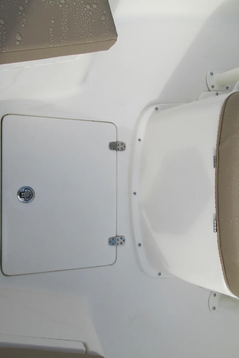 Slide: The Image of 2023 Sea Born LX22 Center Console boat interior with storage compartment. - 24