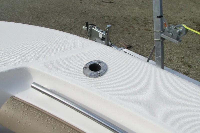 Slide: The Image of 2023 Sea Born LX22 Center Console boat deck with rod holder and trailer. - 30