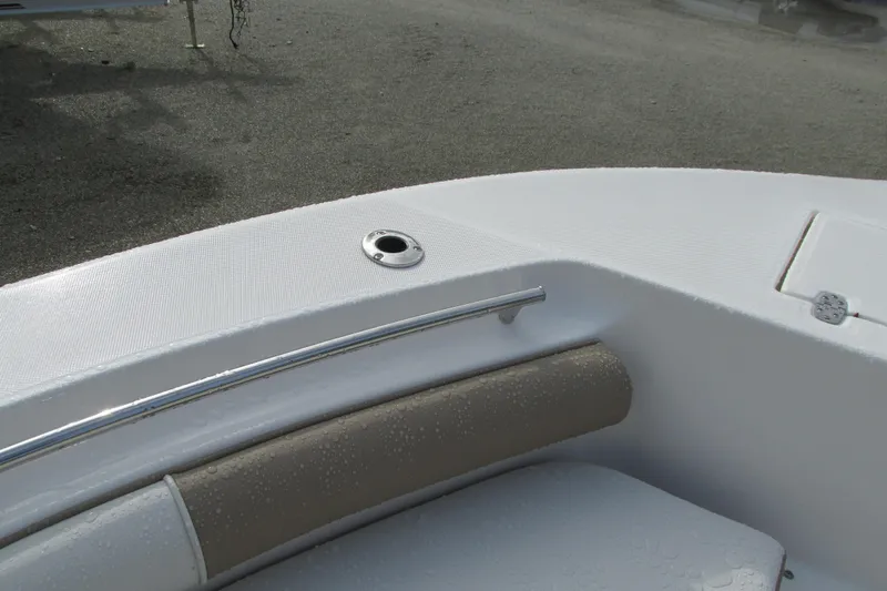 Slide: The Image of 2023 Sea Born LX22 Center Console boat interior with cushioned seating. - 31