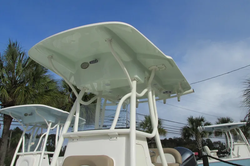 Slide: The Image of 2023 Sea Born LX22 Center Console boat with T-top against blue sky. - 4