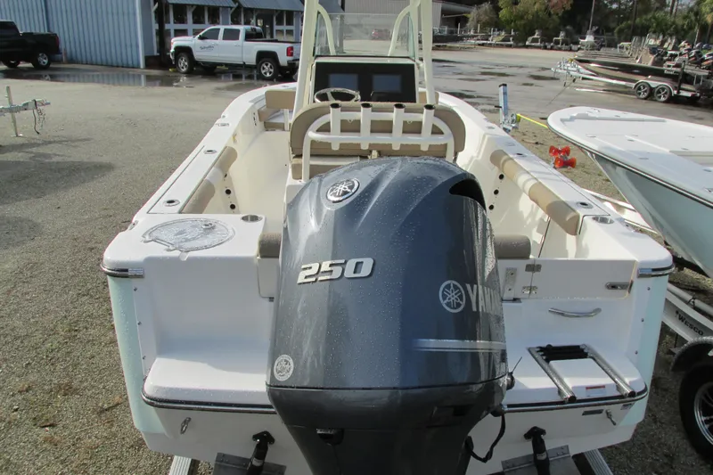 Slide: The Image of 2023 Sea Born LX22 Center Console boat with Yamaha 250 engine, docked outdoors. - 5