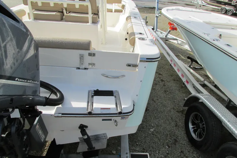 Slide: The Image of 2023 Sea Born LX22 Center Console boat with motor and trailer. - 7