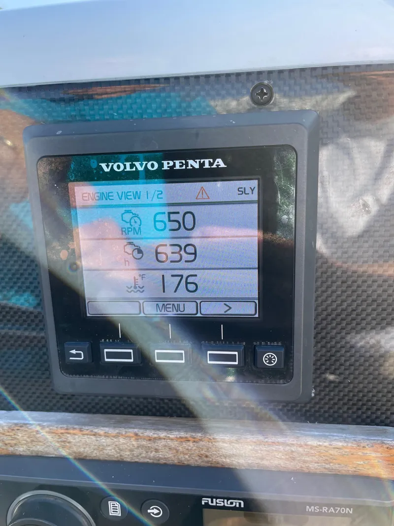Slide: The Image of Volvo Penta engine display on 2011 Novurania Chapman Transition 28, showing RPM and temperature. - 18