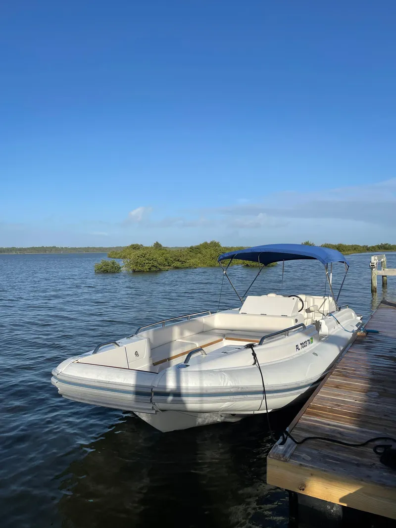 Slide: The Image of 2011 Novurania Chapman Transition 28 boat docked on a sunny day. - 4