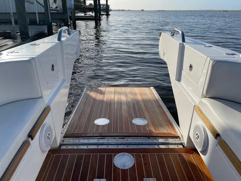 Slide: The Image of Novurania Chapman Transition 28, 2011 model, featuring a wooden deck and water view. - 7