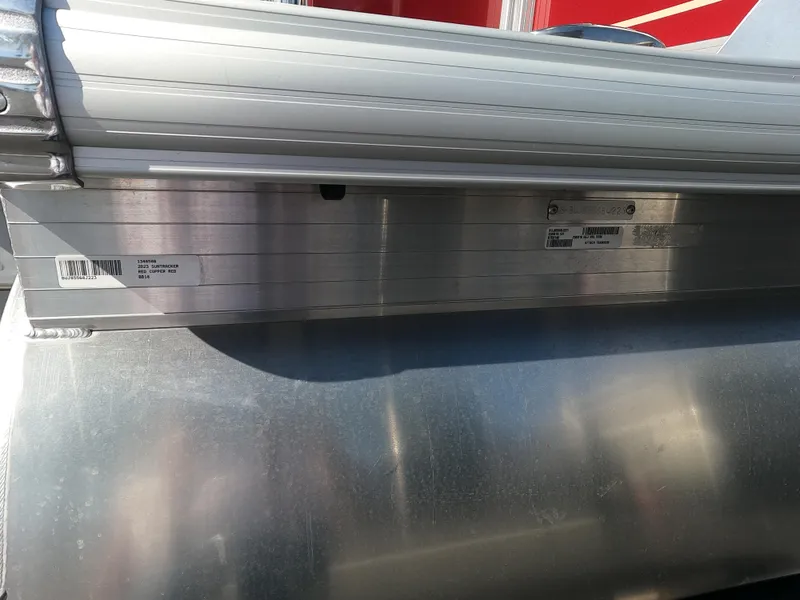 Slide: The Image of Close-up of 2023 Sun Tracker Bass Buggy 18 DLX aluminum pontoon. - 2