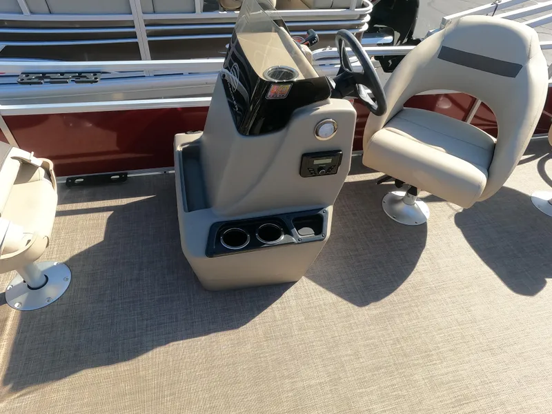Slide: The Image of 2023 Sun Tracker Bass Buggy 18 DLX boat interior with steering console and seating. - 4