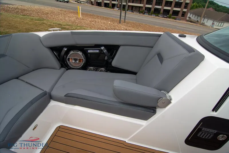 Slide: The Image of 2022 MasterCraft XStar interior seating with gray upholstery and wood accents. - 43