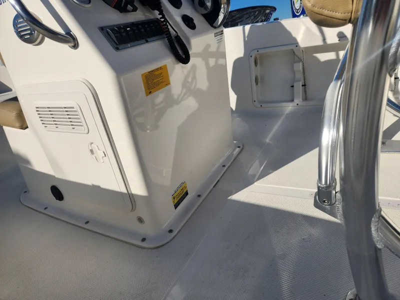 Slide: The Image of 2018 Key West 176 Center Console boat interior with steering wheel and seating. - 10