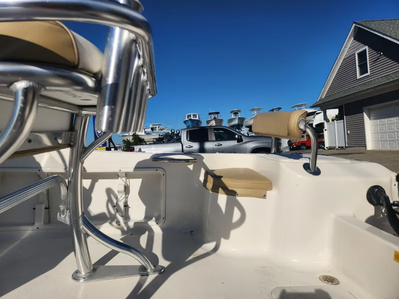 Slide: The Image of 2018 Key West 176 Center Console boat interior with seating and chrome details. - 13