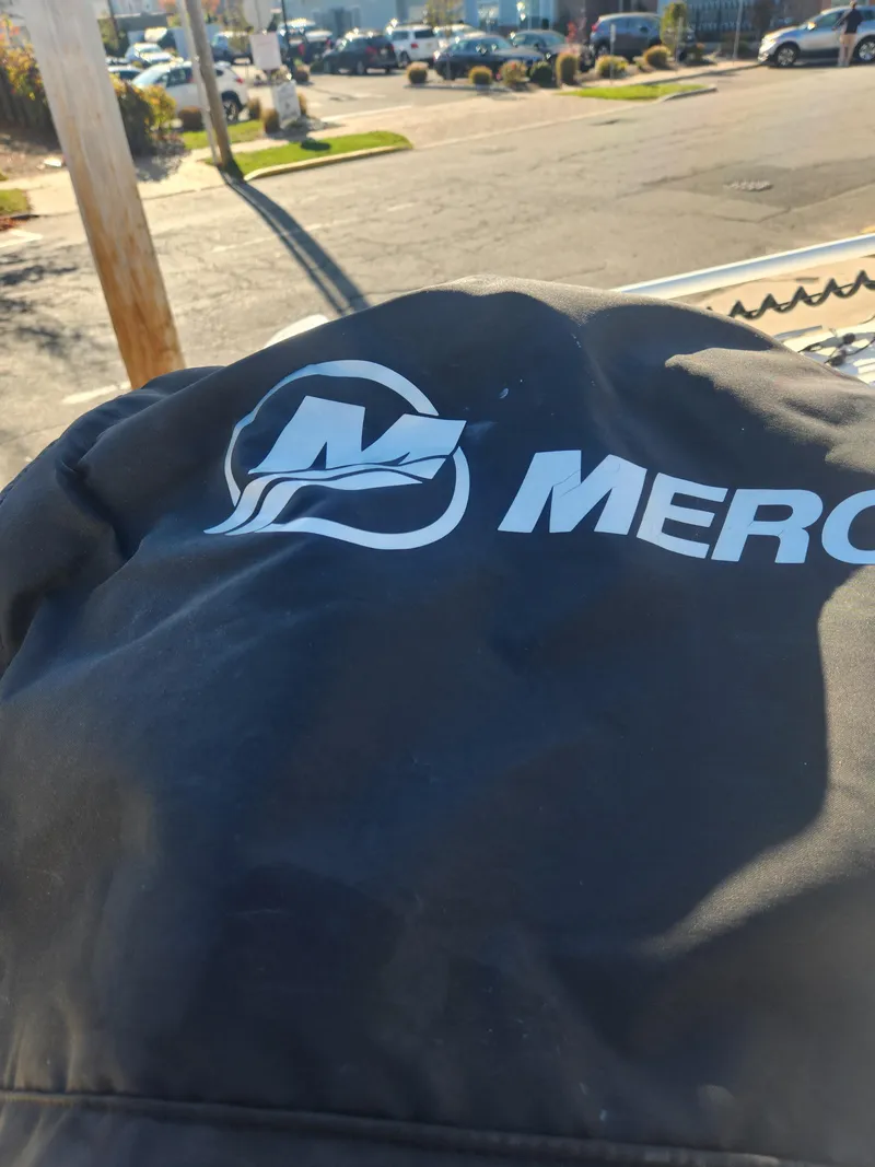 Slide: The Image of Mercury engine cover on a 2018 Key West 176 Center Console boat. - 7