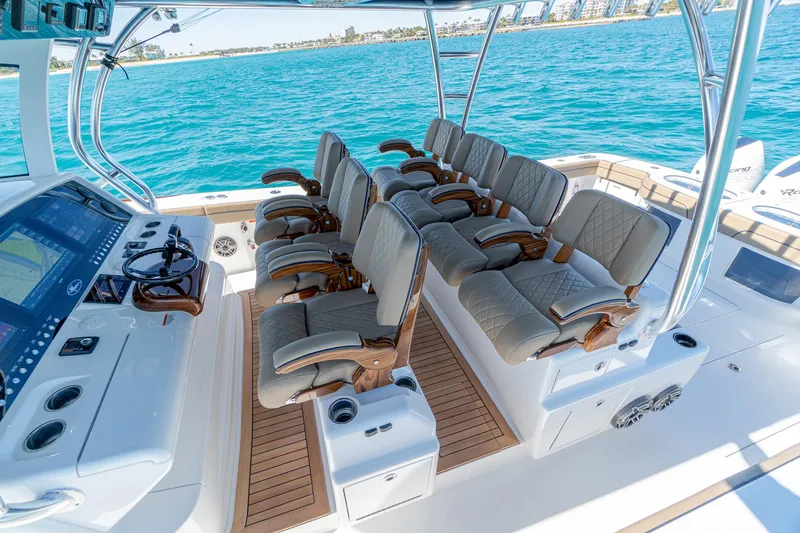 Slide: The Image of 2025 Valhalla Boatworks V-46 interior with luxurious seating and advanced navigation system. - 15