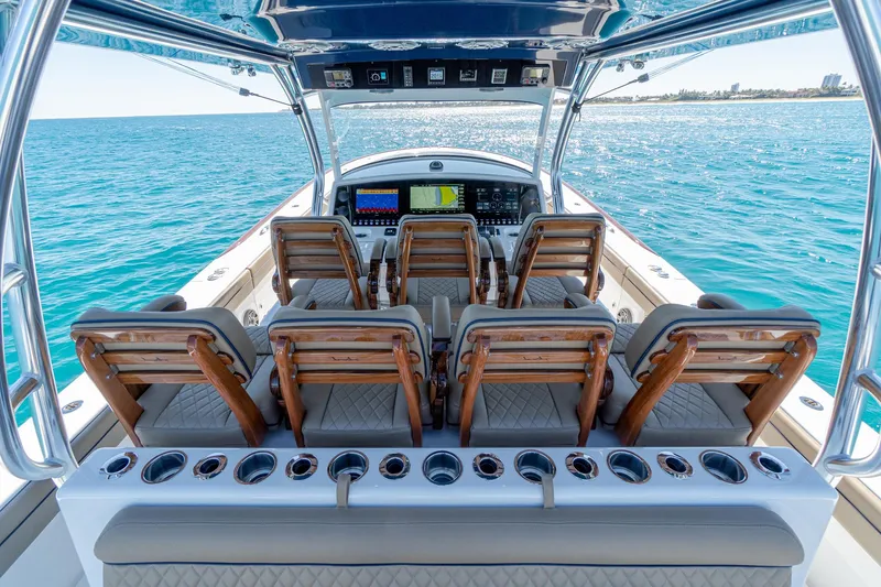 Slide: The Image of 2025 Valhalla Boatworks V-46 helm with multiple seats, advanced navigation, and ocean view. - 18