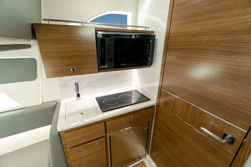 Slide: The Image of Modern kitchen in 2025 Valhalla Boatworks V-46 with wood cabinetry and appliances. - 24