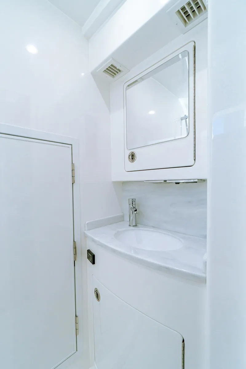 Slide: The Image of 2025 Valhalla Boatworks V-46 bathroom with sleek white design and modern fixtures. - 27