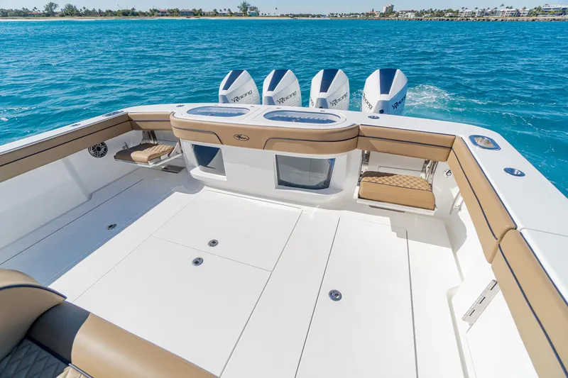 Slide: The Image of 2025 Valhalla Boatworks V-46 with quad engines on clear blue water. - 8