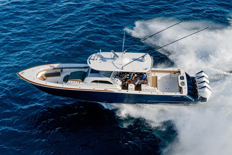Slide: The Image of 2025 Valhalla Boatworks V-46 cruising on open water, showcasing sleek design and powerful engines. - 3