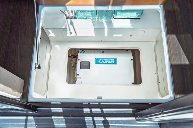 Slide: The Image of Engine compartment of 2026 Jeanneau NC 1295 Fly, showcasing sleek design and modern equipment. - 101