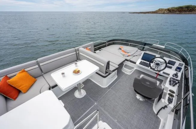 Slide: The Image of 2024 Jeanneau NC 1295 Fly yacht with spacious deck and ocean view. - 18