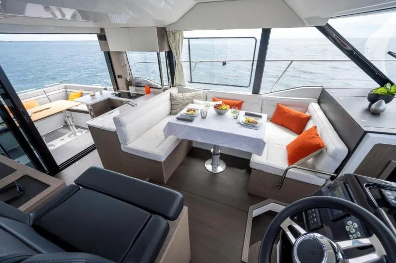 Slide: The Image of Luxurious interior of 2024 Jeanneau NC 1295 Fly yacht with elegant dining area. - 19