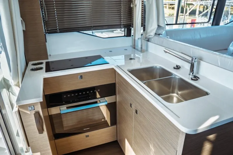 Slide: The Image of Modern kitchen in 2026 Jeanneau NC 1295 Fly yacht with sleek appliances and dual sink. - 26