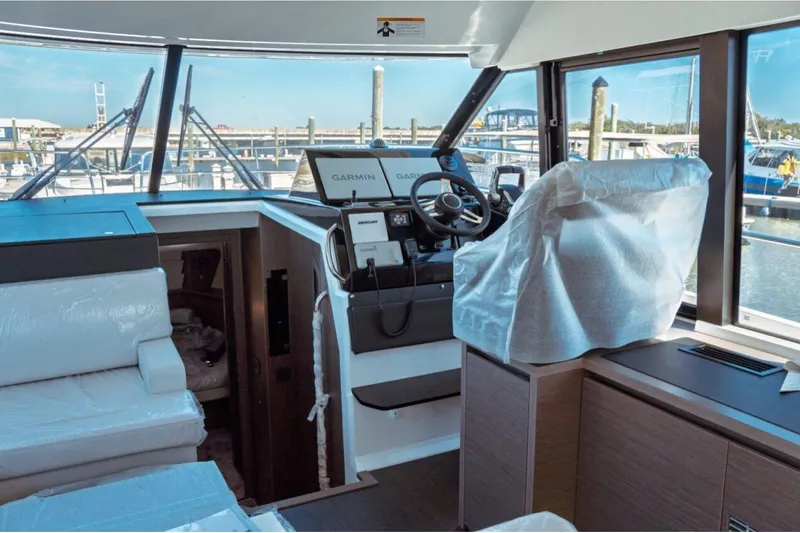 Slide: The Image of Interior of 2026 Jeanneau NC 1295 Fly yacht with modern helm and seating. - 28