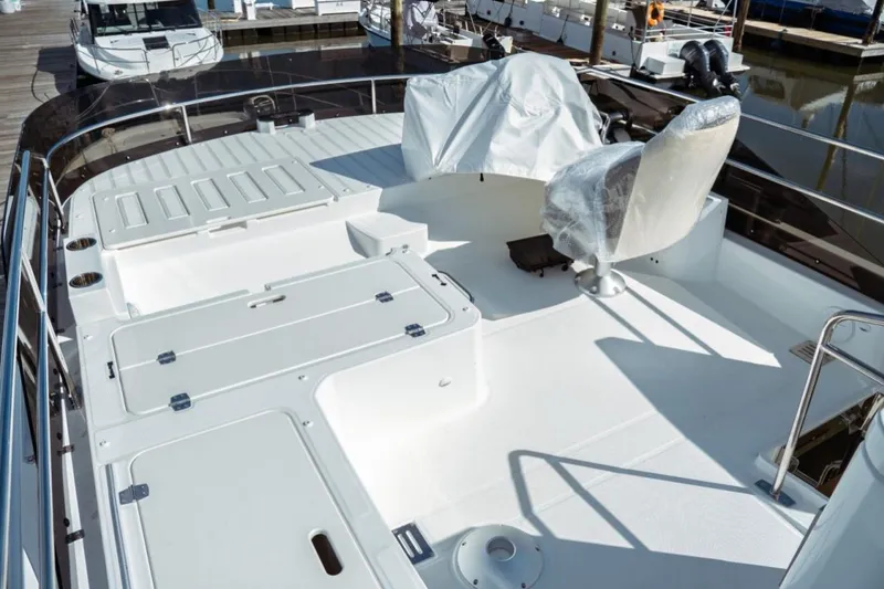 Slide: The Image of 2026 Jeanneau NC 1295 Fly yacht deck with seating and storage compartments. - 31