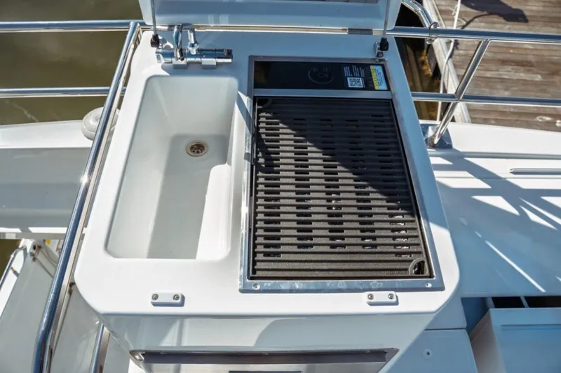 Slide: The Image of Outdoor sink and grill on 2026 Jeanneau NC 1295 Fly yacht deck. - 32