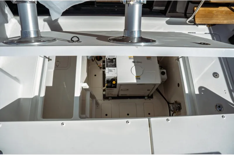 Slide: The Image of 2026 Jeanneau NC 1295 Fly boat interior showing engine compartment details. - 37