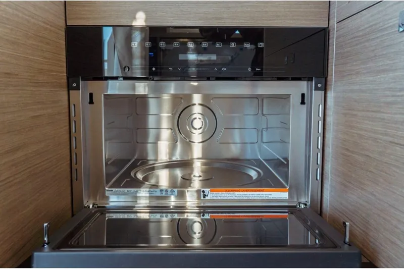 Slide: The Image of Modern microwave oven inside Jeanneau NC 1295 Fly yacht, 2026 model. - 40