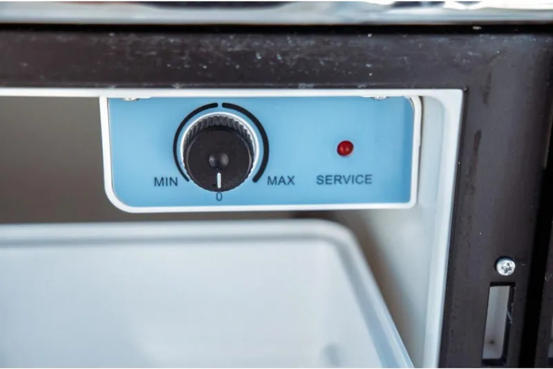 Slide: The Image of Control panel of Jeanneau NC 1295 Fly 2026 boat, featuring a dial and service indicator. - 46