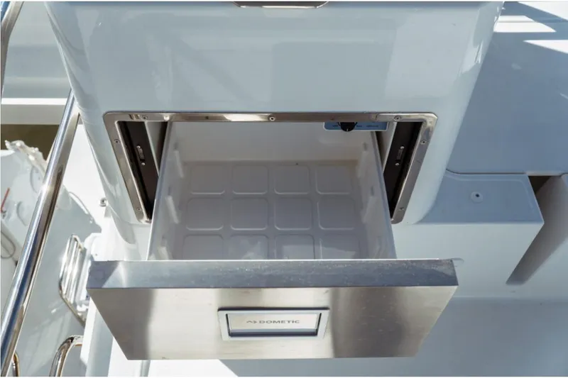 Slide: The Image of Open drawer on Jeanneau NC 1295 Fly 2026 yacht, featuring a Dometic appliance. - 47