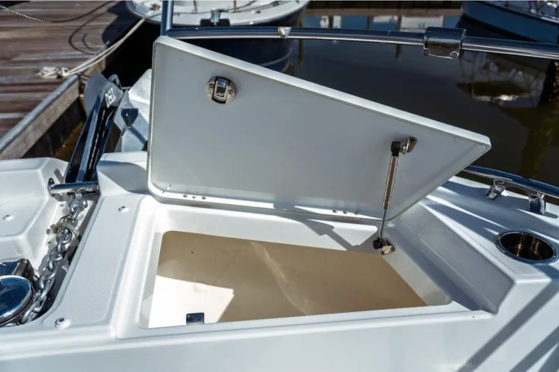 Slide: The Image of Open storage compartment on 2026 Jeanneau NC 1295 Fly boat deck. - 51