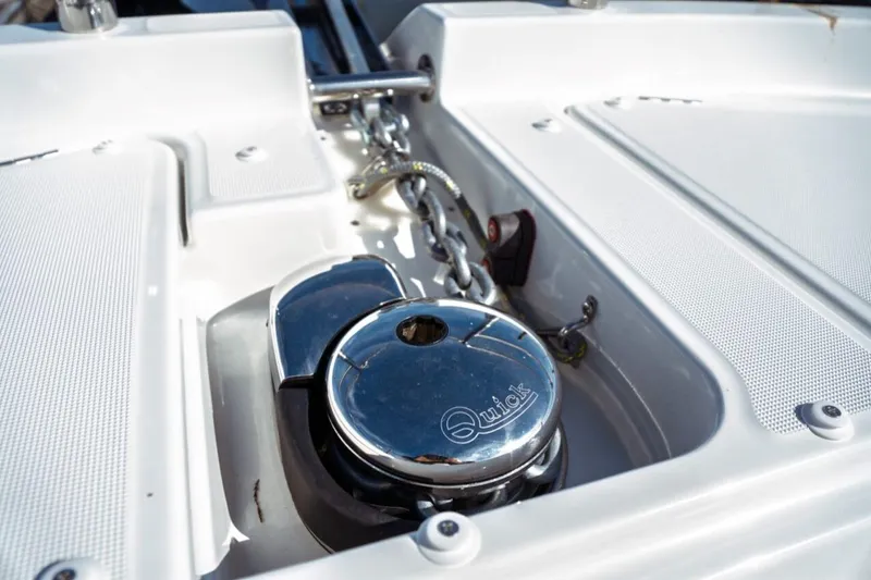 Slide: The Image of Anchor winch on Jeanneau NC 1295 Fly 2026 yacht deck, featuring "Quick" branding. - 53