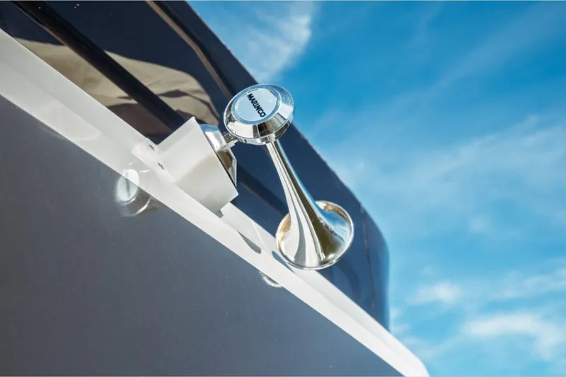 Slide: The Image of Close-up of Jeanneau NC 1295 Fly 2026 boat horn against blue sky. - 56