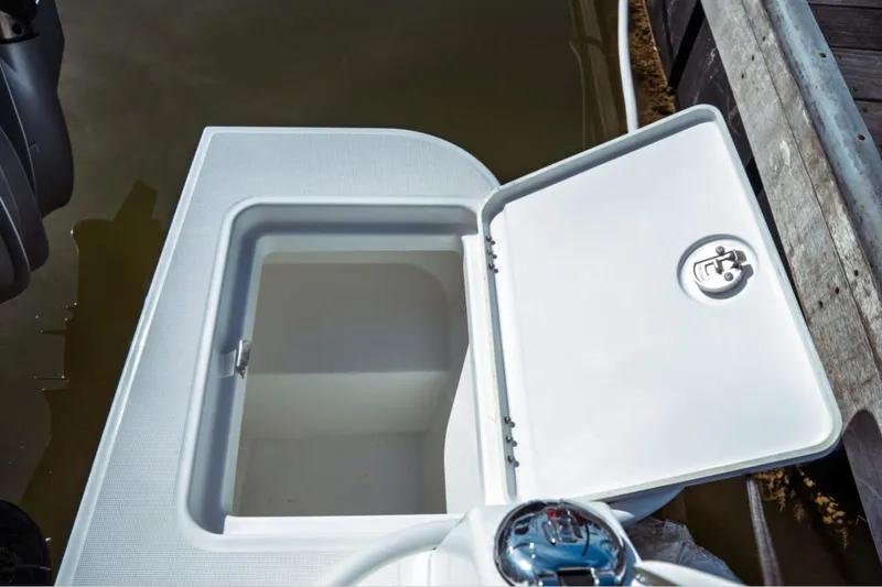 Slide: The Image of Open storage compartment on 2026 Jeanneau NC 1295 Fly boat, dockside view. - 59