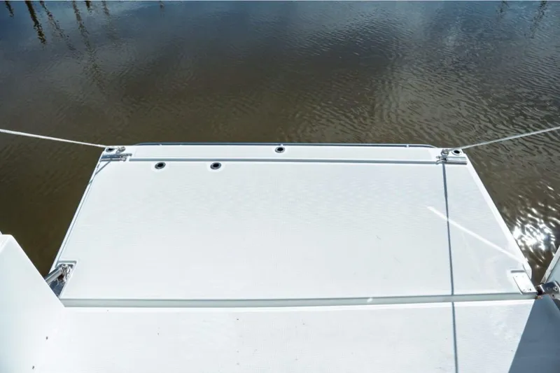 Slide: The Image of 2026 Jeanneau NC 1295 Fly swim platform with water view. - 61