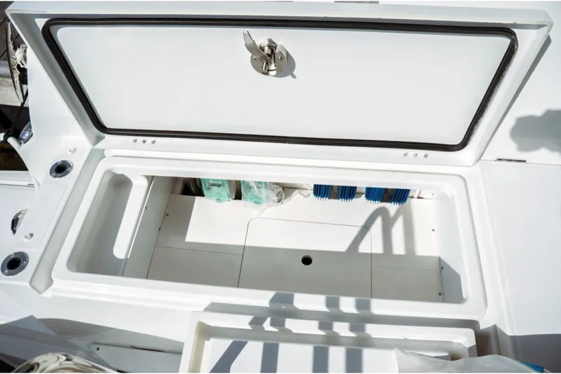 Slide: The Image of Open storage compartment on 2026 Jeanneau NC 1295 Fly yacht, showcasing interior space. - 64