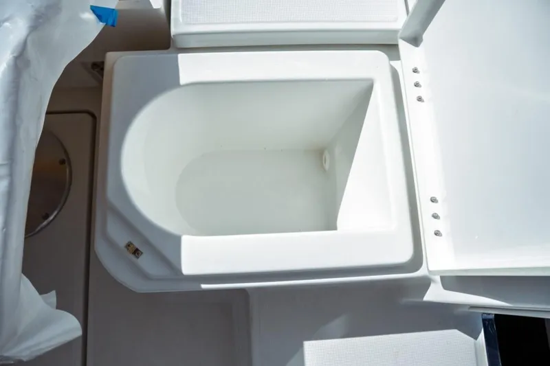 Slide: The Image of Open storage compartment on 2026 Jeanneau NC 1295 Fly boat. - 65