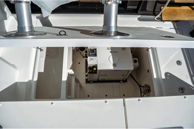 Slide: The Image of 2026 Jeanneau NC 1295 Fly boat engine compartment with generator and storage space. - 66