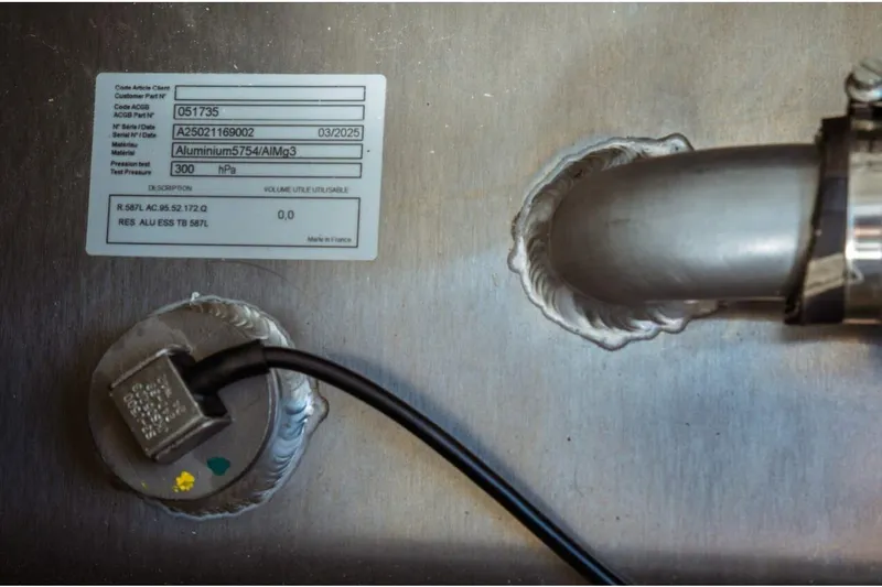 Slide: The Image of Close-up of Jeanneau NC 1295 Fly 2026 aluminum component with label and wiring. - 67
