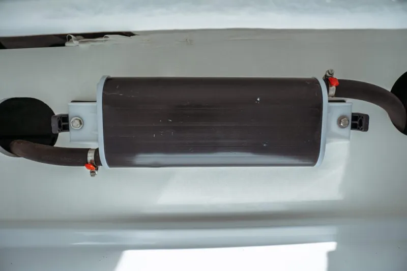 Slide: The Image of Component of Jeanneau NC 1295 Fly 2026 boat, featuring a cylindrical part with attached hoses. - 68