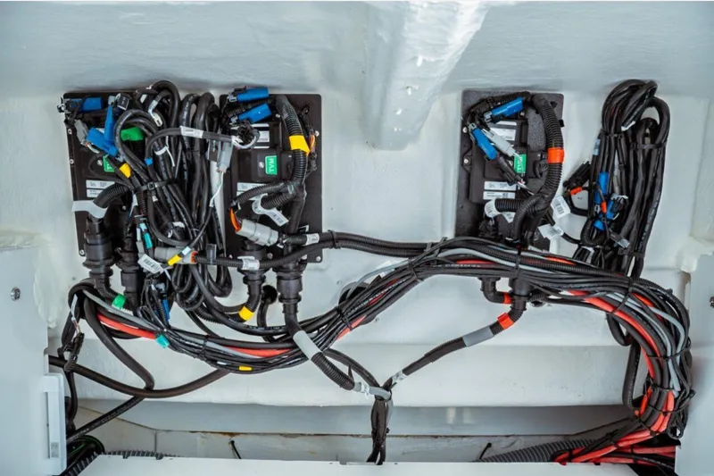 Slide: The Image of Electrical wiring system in 2026 Jeanneau NC 1295 Fly boat, showcasing organized cables and connectors. - 69