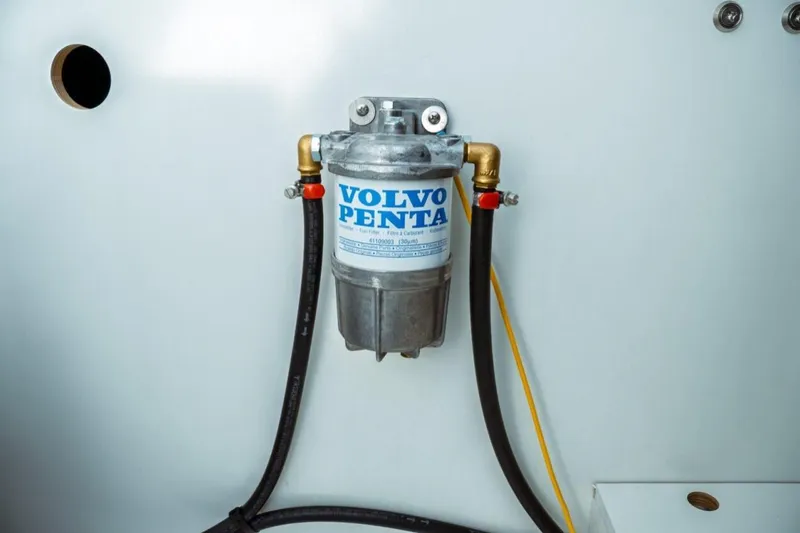 Slide: The Image of Volvo Penta fuel filter in Jeanneau NC 1295 Fly, 2026 model boat engine compartment. - 70