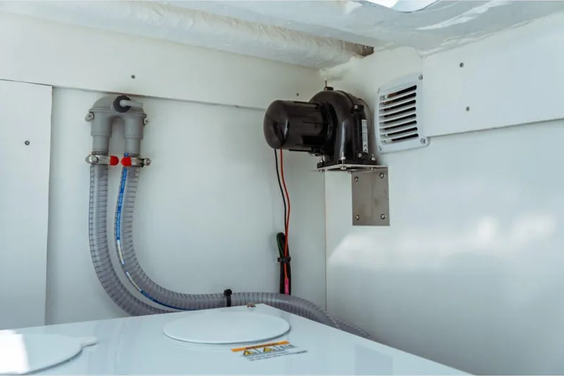 Slide: The Image of Engine compartment of 2026 Jeanneau NC 1295 Fly, showcasing ventilation and wiring. - 71