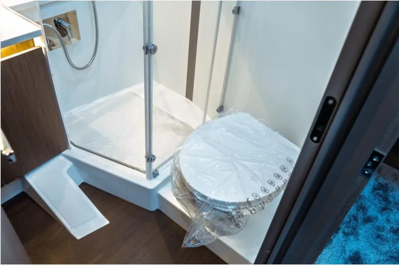 Slide: The Image of Bathroom interior of 2026 Jeanneau NC 1295 Fly yacht, featuring shower and toilet. - 84