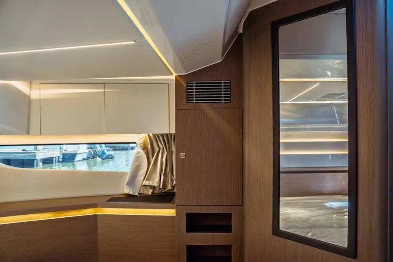 Slide: The Image of Luxurious interior of 2026 Jeanneau NC 1295 Fly yacht with modern wood finishes. - 89