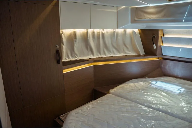 Slide: The Image of Luxurious cabin interior of 2026 Jeanneau NC 1295 Fly yacht with modern wood finishes. - 93