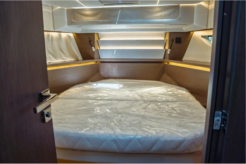 Slide: The Image of Luxurious cabin interior of 2026 Jeanneau NC 1295 Fly yacht with cozy bed. - 94