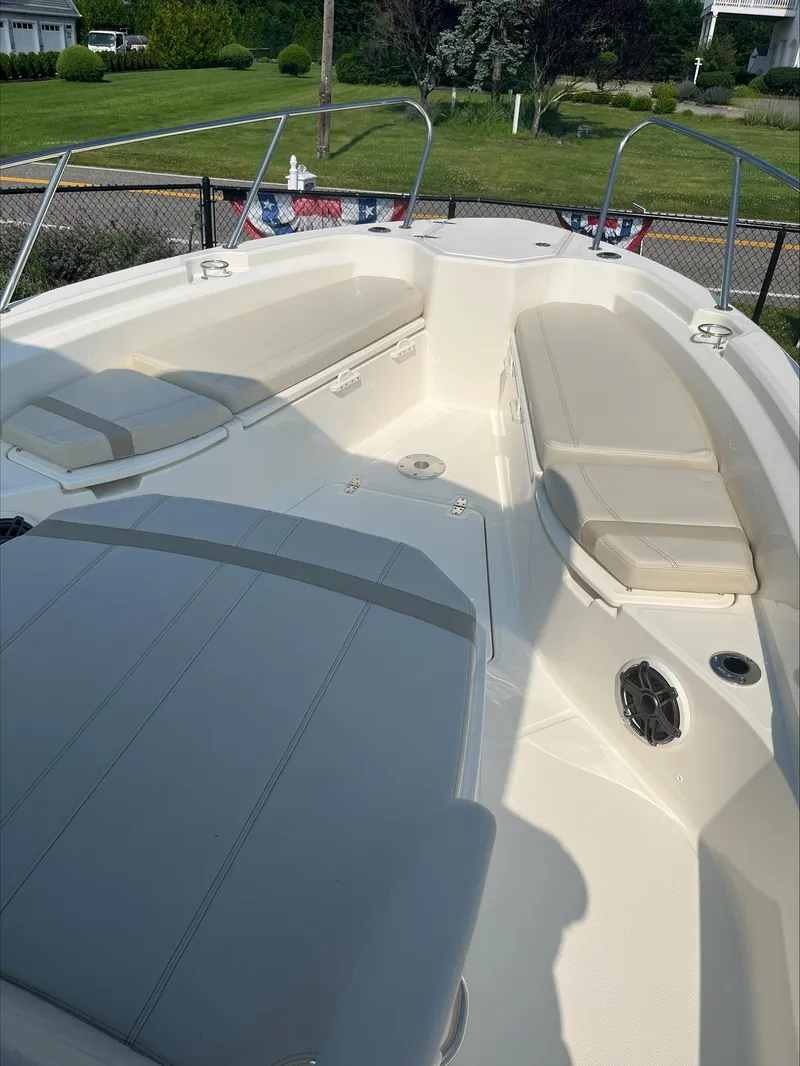 Slide: The Image of 2023 Boston Whaler 280 Dauntless boat with spacious seating and sleek design. - 20